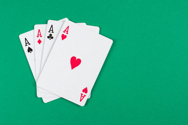 Playing cards on green background - Foto, Bild