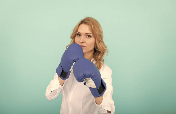 confident businesswoman in boxing gloves. punching. successful ceo boxer. - Photo, Image