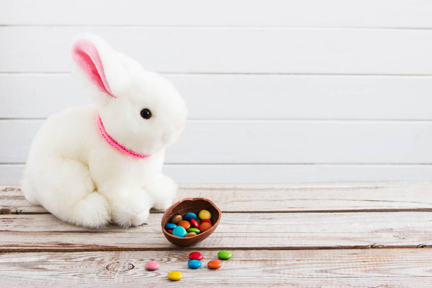 Easter background white bunny dragee chocolate egg. - Φωτογραφία, εικόνα