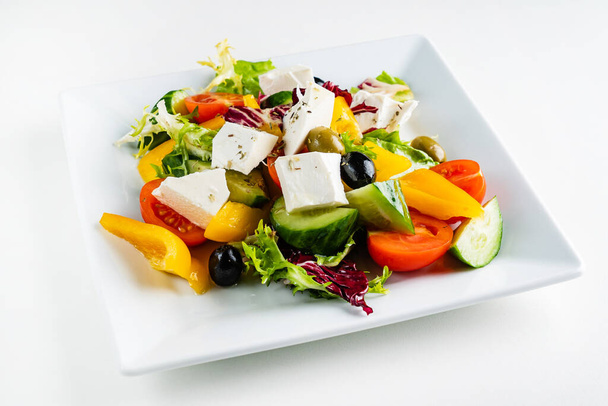 greek salad with feta on the white plate - Photo, image