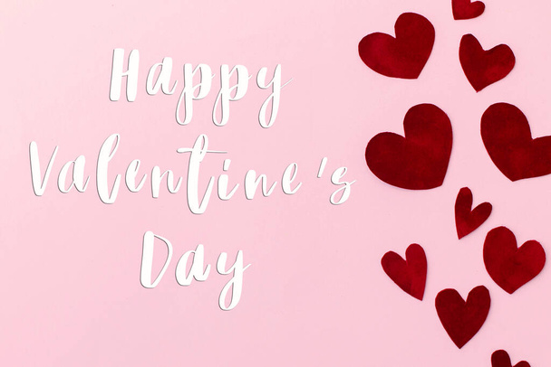 Happy Valentines Day greeting card. Happy Valentine's Day text on stylish red hearts on pink background. Be my Valentine. Love concept - Photo, Image