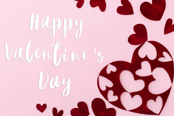 Happy Valentines Day greeting card. Happy Valentine's Day text on stylish red hearts on pink background. Be my Valentine. Love concept - Fotó, kép