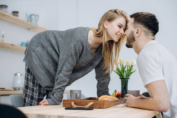 Young couple having breakfast in kitche - Photo, Image