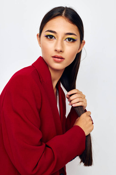 beautiful brunette bright makeup red jacket posing studio model unaltered - Foto, Imagem