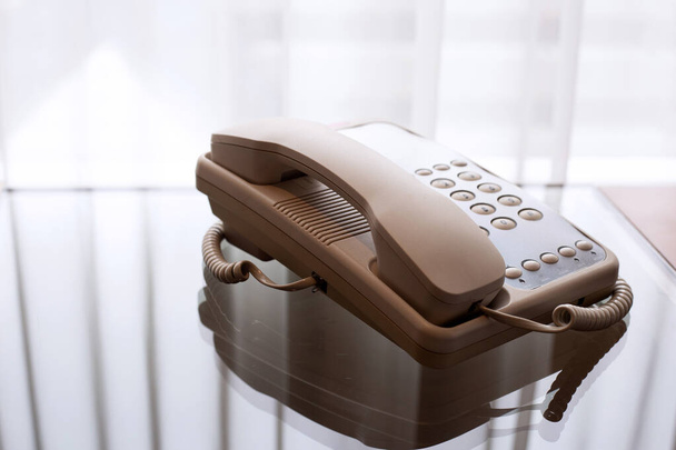 Landline phone on glass table - Photo, Image