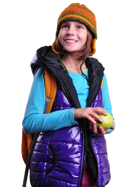 happy smiling schoolgirl with backpack and apple isolated over white - Foto, imagen