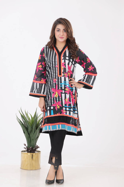 A Pakistani shalwar kameez suit with dupatta. Pakistani model is shown her dress with style. Digital Kurti is black and white. - Φωτογραφία, εικόνα