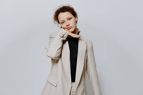 portrait of a young woman in a suit gestures with his hands emotions isolated backgrounds unaltered - Fotografie, Obrázek