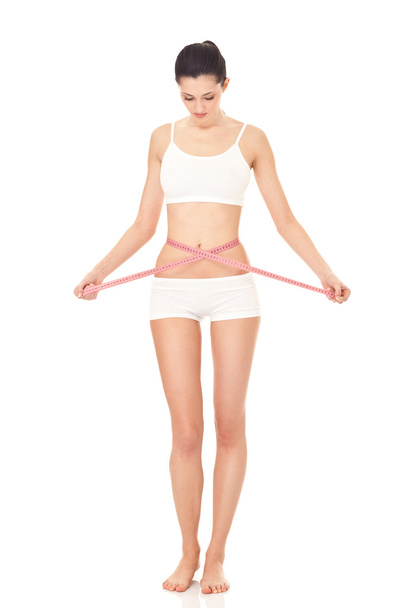 Girl measuring her waistline - Photo, Image