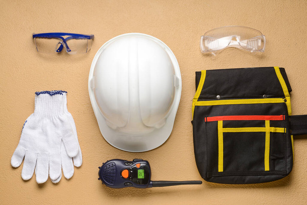 Safety equipment with radio transmitter on color background - Photo, Image