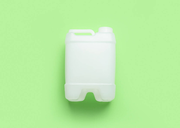 Plastic canister on color background - Zdjęcie, obraz
