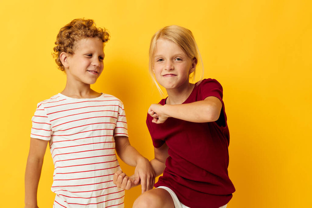 cheerful children casual wear games fun together isolated background - Фото, зображення