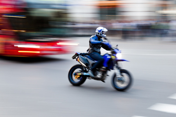Motorcycle in motion blur in the city traffic - Fotó, kép