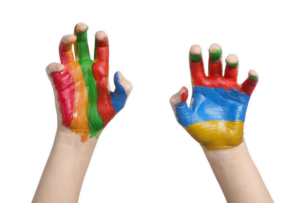 Child's hands in paints on white background - Фото, изображение