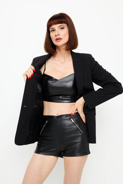 photo pretty woman in leather skirts posing glamor sexy Lifestyle unaltered - Foto, imagen