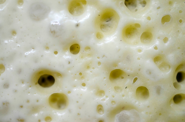 Close-up view of crepes dough, pancakes during the cooking process, top view, macro photo - Foto, Bild