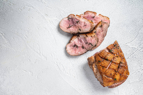 Roasted Sliced Duck breast fiilet steak. White background. Top view. Copy space - Photo, Image