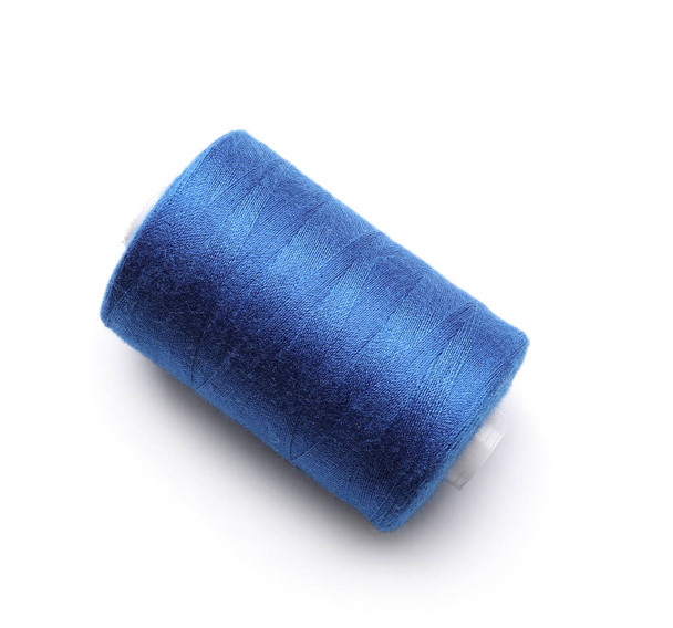 Blue sewing thread spool on white background - Photo, Image