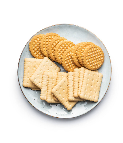 Butter biscuits on plate. Sweet cookies isolated on white background. - Fotó, kép
