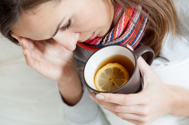 Ill woman drinking tea - Photo, image