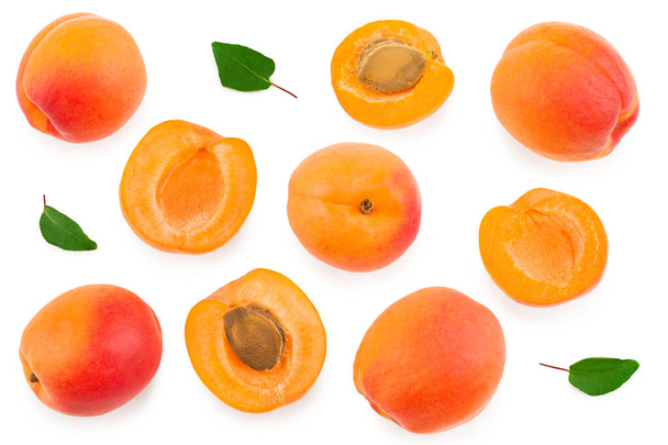 apricot fruits with slices and green leaf isolated on white background. clipping path. top view - Foto, afbeelding