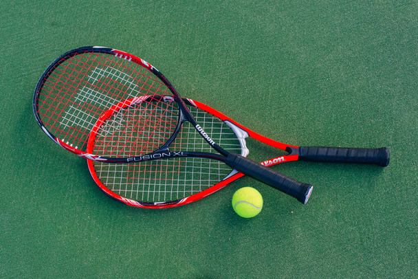 Sport. Close up picture of racket and tennis ball on court. Sport, healthy and lifestyle concept. High quality photo - Foto, Imagem