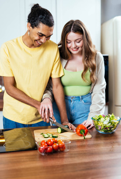 Modern multiethnic unstereotyped couple lifestyle moments at home. Not stereotyped boyfriend and girlfriend living together. True love concepts - Photo, Image