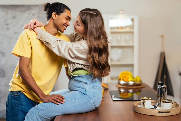 modern multiethnic unstereotyped couple lifestyle moments at home. Not stereotyped boyfriend and girlfriend living together. True love concepts - Fotoğraf, Görsel
