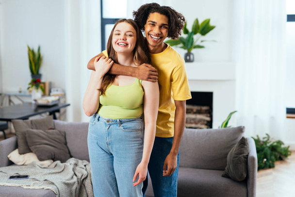 modern multiethnic unstereotyped couple lifestyle moments at home. Not stereotyped boyfriend and girlfriend living together. True love concepts - Фото, изображение