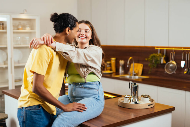 modern multiethnic unstereotyped couple lifestyle moments at home. Not stereotyped boyfriend and girlfriend living together. True love concepts - 写真・画像