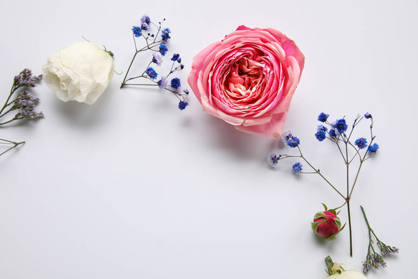 Composition with different beautiful flowers on light background - 写真・画像