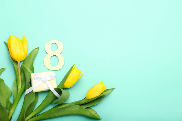 Composition with paper figure 8, gift box and tulips for International Women's Day celebration on color background - Φωτογραφία, εικόνα