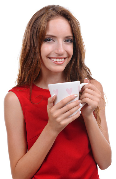 Beautiful young girl with cup of coffee on white background - Φωτογραφία, εικόνα