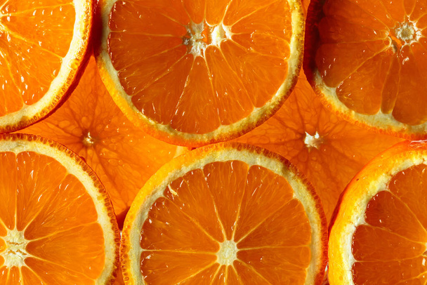 Nahaufnahme von Orangenscheiben als Hintergrundstruktur. - Foto, Bild