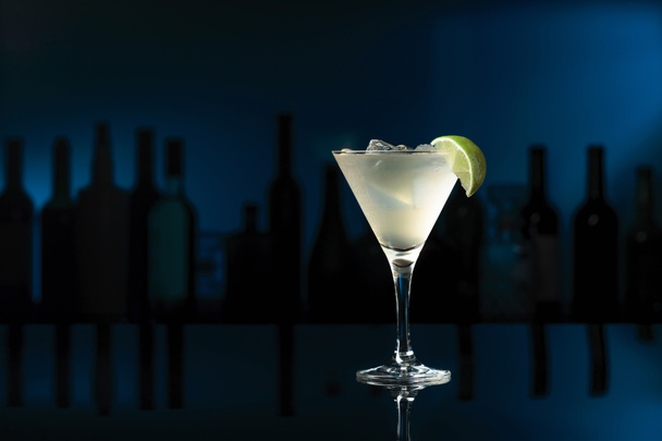 Cocktail "Daiquiri" on a black reflective background. Copy space. - 写真・画像