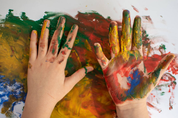 Child hands after paining with hands  - Photo, Image