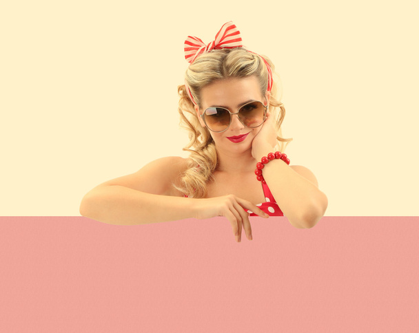 Beautiful girl with pretty smile in pinup style - Photo, image
