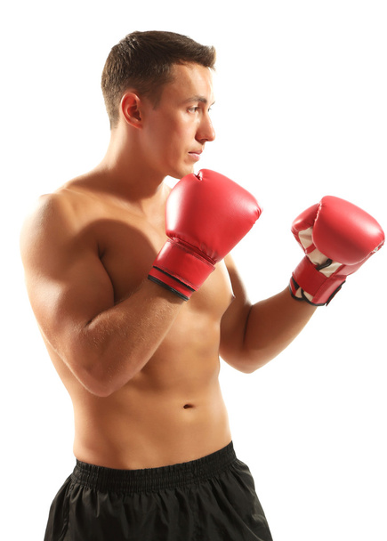 Handsome young muscular sportsman with boxing gloves isolated on white - Fotoğraf, Görsel