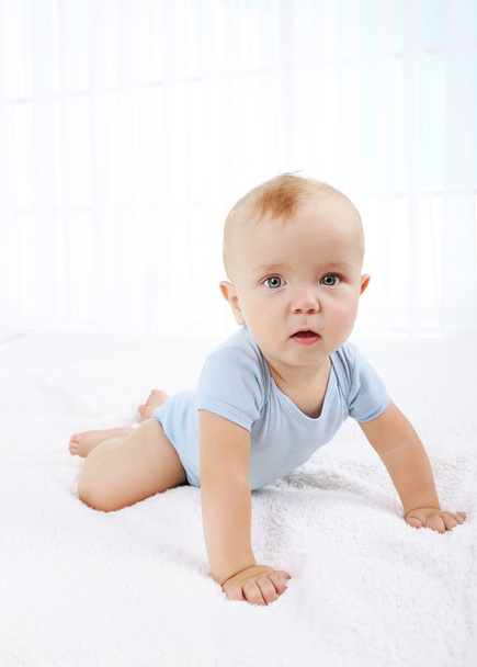 Cute baby boy on bed in room - Photo, Image
