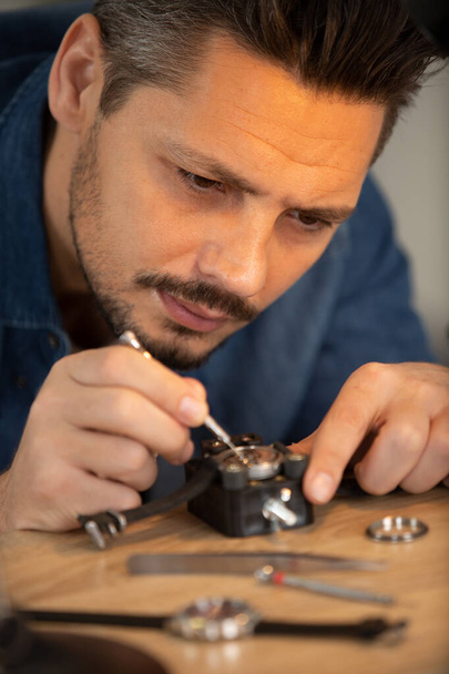 close up of watchmaker repair mechanical watch - Fotó, kép