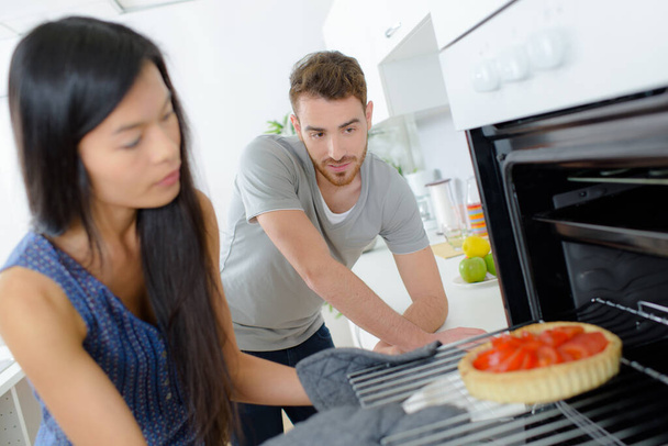 Young couple cooking at home - Foto, imagen
