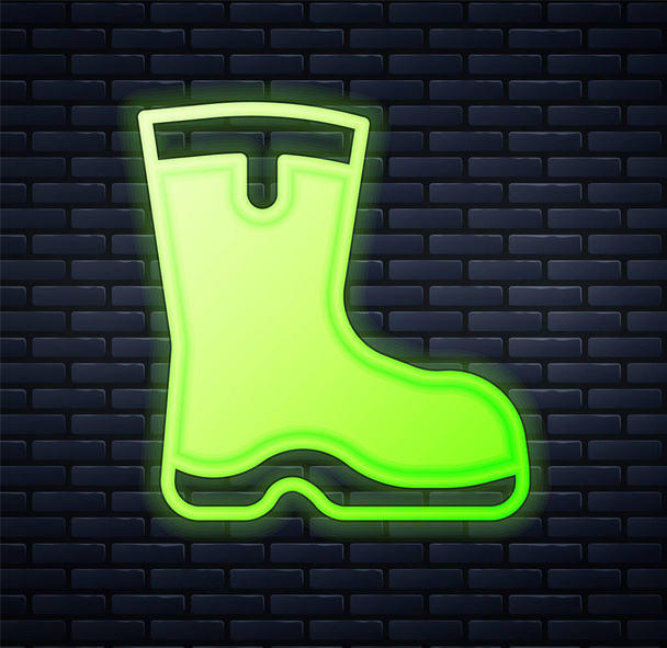 Zářící neon Rybářské boty ikona izolované na cihlové zdi pozadí. Vodotěsné gumové boty. Žvýkačky pro deštivé počasí, rybaření, lovce, zahradničení. Vektor - Vektor, obrázek