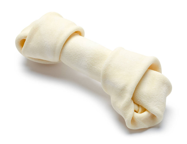 Small Rawhide Dog Bone Cut Out on White. - Photo, Image