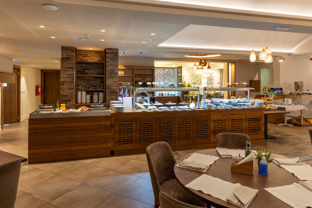 Breakfast served on buffet table in the modern hotel - Photo, image