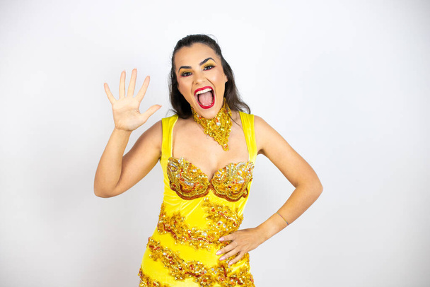 Young beautiful woman wearing carnival costume over isolated white background showing and pointing up with fingers number five while smiling confident and happy - Foto, Imagen