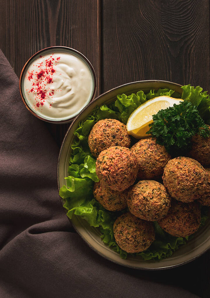 Chickpea falafel balls, on a wooden table, close-up, vegetarian food, - Photo, image