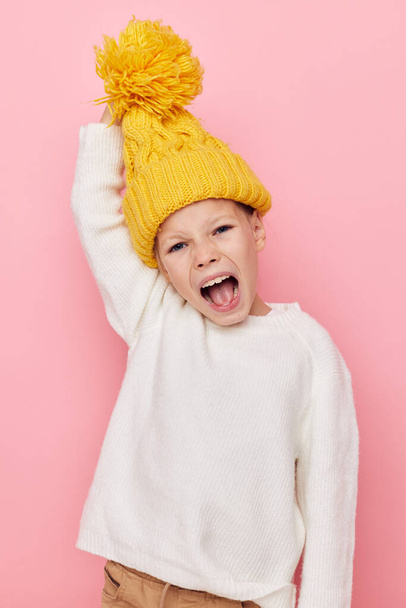 Portrait of happy smiling child girl fun in a yellow hat fun childhood unaltered - Фото, изображение