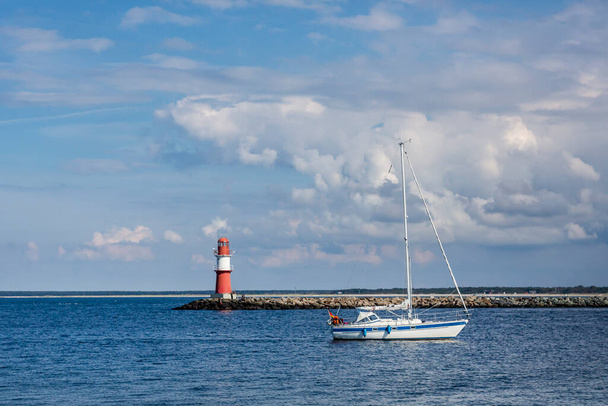 harbour exit of Warnemuende near Rostock with sail boat, Baltic Sea coast area travel destination in Mecklenburg-Vorpommern in the north-east of Germany - Foto, Imagem