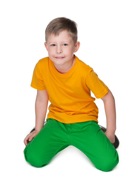 Cute young boy in a yellow shirt - Фото, изображение