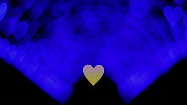 4K UHD φόντο βίντεο για την Ημέρα του Αγίου Βαλεντίνου. Σύνορα με bokeh της ρομαντικής λάμπει μπλε καρδιές σε ένα σκοτεινό φόντο. Αγάπη, bokeh σε σχήμα καρδιάς. Υψηλής ποιότητας βίντεο 4k. - Πλάνα, βίντεο